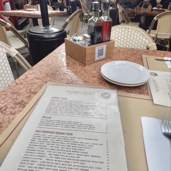 Maccheroni Republic - Patio seating and menu view - outdoor heaters and quaint comfy atmosphere - Italian Near Me - Los Angeles, California