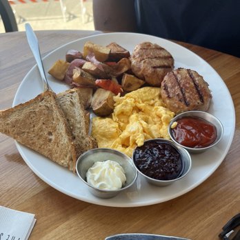 The Strand - Breakfast plate : potatoes, eggs how ever you want, toast, chicken sausage - Beaches Near Me