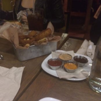 Bareburger - Astoria - Onion Ring & Fries Combo. Comes with 4 different sauces. - Burgers Near Me - Astoria, New York Bareburger - Astoria - Onion Ring & Fries Combo. Comes with 4 different sauces. - Burgers Near Me - Astoria, New York