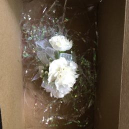 $28 Corsage in a cardboard box. $28 Corsage in a cardboard box.