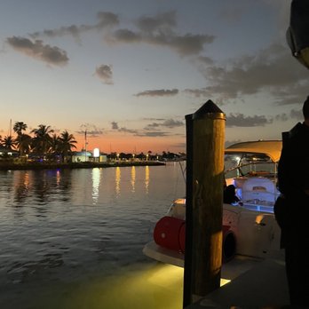 Billy's Stone Crab - Market - a man standing on a dock at night - Seafood Markets Near Me - Hollywood, Florida Billy's Stone Crab - Market - a man standing on a dock at night - Seafood Markets Near Me - Hollywood, Florida