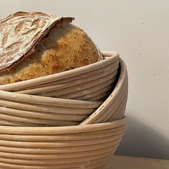 Lucky Lady Bread - a loaf of bread in a basket - Bakeries Near Me Lucky Lady Bread - a loaf of bread in a basket - Bakeries Near Me