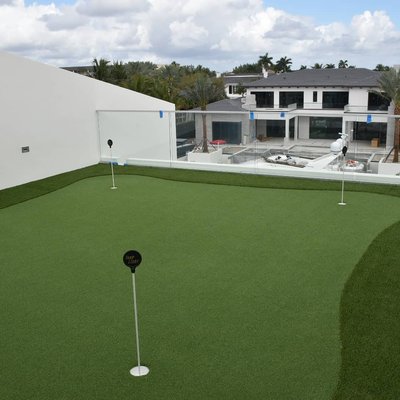 Rooftop Putting Green - For this project we used a 2" elevated base system that allowed us to have a perfect drainage and to use short cups over the waterproofed roof. By adding Envirofill infill on top, we created a surface that doesn't allow the mold to grow, it's safer to the kids because of the Microban and keeps the turf cooler. Rooftop Putting Green - For this project we used a 2" elevated base system that allowed us to have a perfect drainage and to use short cups over the waterproofed roof. By adding Envirofill infill on top, we created a surface that doesn't allow the mold to grow, it's safer to the kids because of the Microban and keeps the turf cooler.