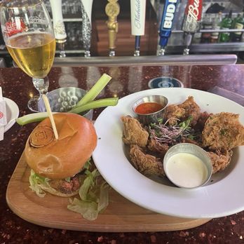 La Cage - Buffalo chicken sandwich with onion petals - Sports Bars Near Me - Montreal, Quebec La Cage - Buffalo chicken sandwich with onion petals - Sports Bars Near Me - Montreal, Quebec