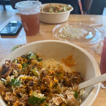 CAVA - Saffron Bismati rice, spicy chicken, orange paste (lol), corn, cucumbers, green sauce (lol) - Mediterranean Near Me - Austin, Texas CAVA - Saffron Bismati rice, spicy chicken, orange paste (lol), corn, cucumbers, green sauce (lol) - Mediterranean Near Me - Austin, Texas