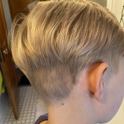 Pitt's Barber Shop - I pointed out the spot he missed and the barber laughed and said "well you don't want him bald, do ya??" and sent us on our way.