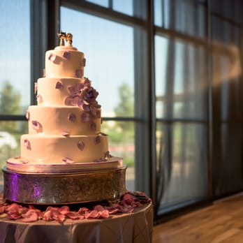 Le Duc Gourmet Bakery - My 4-tiered mango mousse wedding cake. They offer cake stands for rental, as pictured. - Bakeries Near Me - Houston, Texas