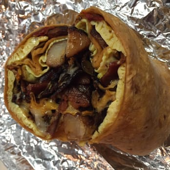 Toomey's - Breakfast burrito.  Some burnt bacon and small by breakfast burrito standards. - New American Near Me - Mammoth Lakes, California