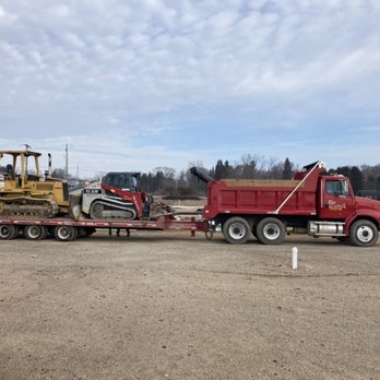 Dirt Scapes - a tractor and a bulldozer on a flatbed trailer - Excavation Services Near Me Dirt Scapes - a tractor and a bulldozer on a flatbed trailer - Excavation Services Near Me