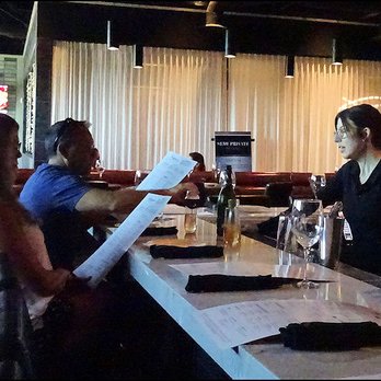 Bennett's Westside Grill - Friendly bartender, Alexis, serves two locals mimosas and explains the brunch menu. - American Near Me - Rocklin, California