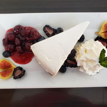 Underground Public House - a slice of cheesecake with fruit and ice cream - American Near Me - Carbondale, Illinois Underground Public House - a slice of cheesecake with fruit and ice cream - American Near Me - Carbondale, Illinois
