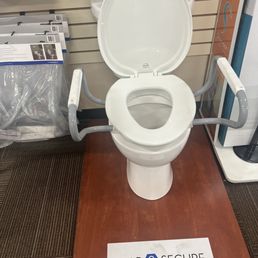 Raised toilet seat ( we all should have a raised seat) and handles to get up off of. Raised toilet seat ( we all should have a raised seat) and handles to get up off of.