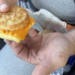 McDonald's - A hard biscuit over cooked egg with cheese that was just melted in microwave