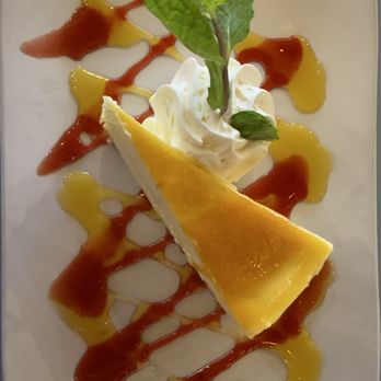 Stinger Ray's Tropical Bar & Grill - Lilikoi mango cheesecake - Bars Near Me - Honolulu, Hawaii Stinger Ray's Tropical Bar & Grill - Lilikoi mango cheesecake - Bars Near Me - Honolulu, Hawaii