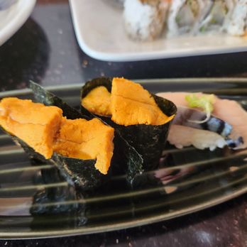 Toshi Sushi - 2 pieces of uni nigri and 1 piece of saba nigri - Sushi Bars Near Me - Vancouver, British Columbia