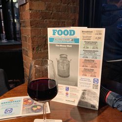 The Mossy Well - Glass of Merlot and front cover of menu. Cheers!