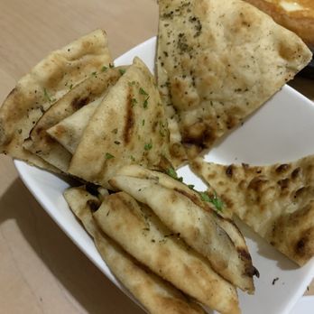 Colossus Greek Taverna - Triangle bread - Greek Near Me - Oakville, Ontario Colossus Greek Taverna - Triangle bread - Greek Near Me - Oakville, Ontario