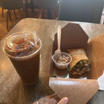 Wild Harvest Cafe - Chicken Caesar Wrap with macaroni salad as the side and a large hazelnut iced coffee - Breakfast & Brunch Near Me - East Greenwich, Rhode Island Wild Harvest Cafe - Chicken Caesar Wrap with macaroni salad as the side and a large hazelnut iced coffee - Breakfast & Brunch Near Me - East Greenwich, Rhode Island