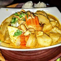 Chiangmai - Massaman Curry: Beef, shrimp and tofu in a rich red curry and peanut sauce with coconut milk, carrots, onions and potatoes.