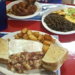Paradis Des iLes Restaurant - Chicken in Sauce with sides and House Specialty eggs and hash.