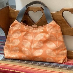 Orla Kiely - My daughter gave me a Orla Kiely. She said she didn't have a problem in the rain. I enjoy carrying this bag. Comfortable and roomy. 06/23/23