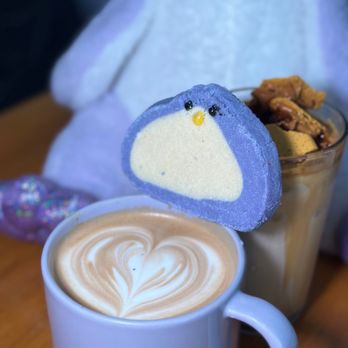 Purple Penguin Cafe - a cup of cappuccino and a penguin cookie - Coffee & Tea Near Me - Toronto, Ontario