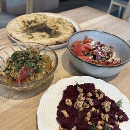 Pita, zaalouk, beet muhammara, tomato salad