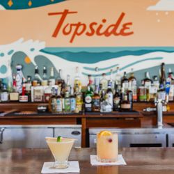 Topside at the Beacon - Cocktails, coastal breeze, and a rooftop view that never gets old.