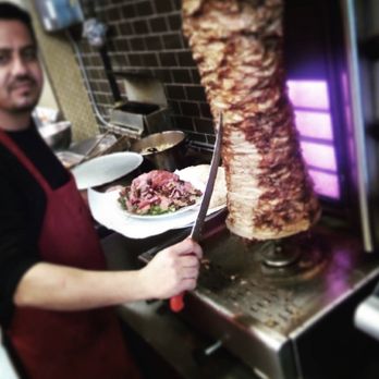 Kurdistan Shawarma - a man preparing food in a kitchen - Middle Eastern Near Me - Toronto, Ontario Kurdistan Shawarma - a man preparing food in a kitchen - Middle Eastern Near Me - Toronto, Ontario