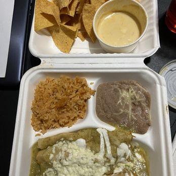 Mexico City Cafe - Chips & Queso Dip/carnitas enchiladas with mild verde salsa plus Mexican Rice and Refried Pinto Beans - Mexican Near Me - St Louis Park, Minnesota Mexico City Cafe - Chips & Queso Dip/carnitas enchiladas with mild verde salsa plus Mexican Rice and Refried Pinto Beans - Mexican Near Me - St Louis Park, Minnesota