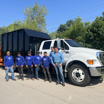 Elite Arborist - group of men standing in front of a garbage truck - Landscaping Near Me Elite Arborist - group of men standing in front of a garbage truck - Landscaping Near Me