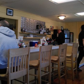 Chach Restaurant - Some counter seating, there's an additional dining room with booths and tables to the side (with a step down) - Diners Near Me - Provincetown, Massachusetts