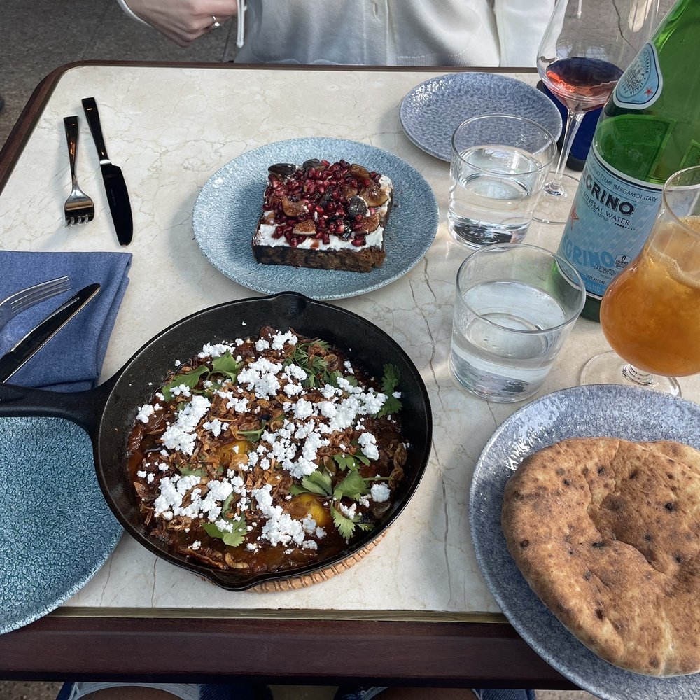 K'Far - Lower middle: Shakshuka and pita to the bottom right Above it is the kubaneh ricotta  So so yummy! Drink is Avner Palmer - Breakfast & Brunch Near Me - Brooklyn, New York