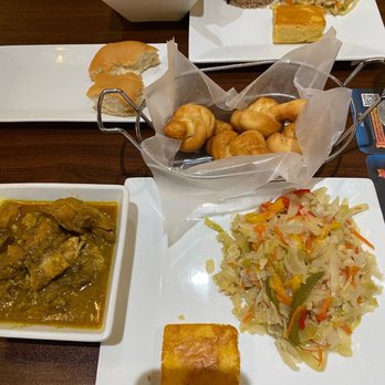 Bonfire - Curried Chicken, Festivals, steamed cabbage, cocco bread, Pork Stew - Caribbean Near Me - Gulfport, Mississippi