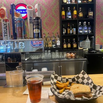 Firkin & Fox - a sandwich and a drink on a table - Pubs Near Me - Dulles, Virginia Firkin & Fox - a sandwich and a drink on a table - Pubs Near Me - Dulles, Virginia