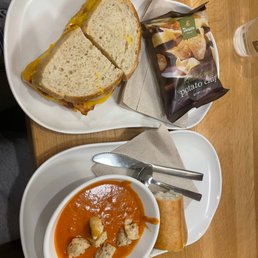 bacon grilled on sourdough bread with tomato soup and chips