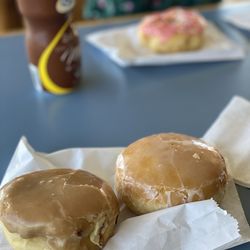 Golden Donut - Maple custard filled, glazed jelly filled and pink sprinkle donut