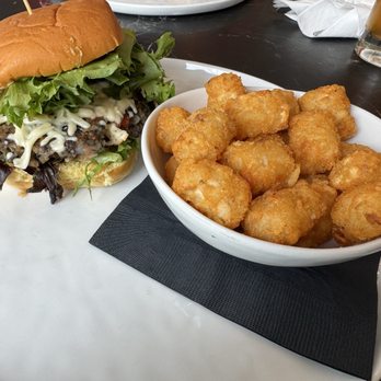 Graze - Veggie burger & tots, iced green tea in the background - Waffles Near Me - Tampa, Florida