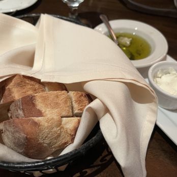 Gio's Prime 26 - fresh baked bread with whipped butter and olive oil with roasted garlic and seasonings - Seafood Near Me - Rochester, New York Gio's Prime 26 - fresh baked bread with whipped butter and olive oil with roasted garlic and seasonings - Seafood Near Me - Rochester, New York