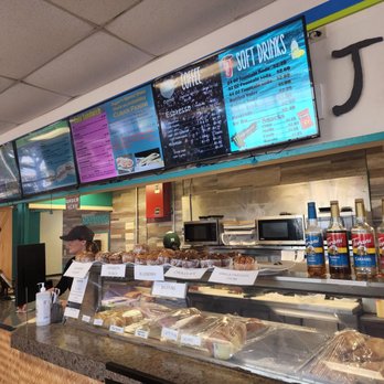 Jagger's Cafe - a woman ordering food at the counter - Bagels Near Me - Pearl Harbor, Hawaii
