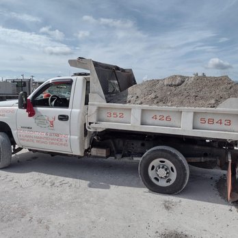 Chrome Property Solutions - a white truck with a flat bed full of dirt - Masonry/Concrete Near Me - Micanopy, Florida Chrome Property Solutions - a white truck with a flat bed full of dirt - Masonry/Concrete Near Me - Micanopy, Florida