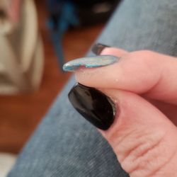 Kim’s Nail & Spa - Jagged uneven edges on my nails, as well as paint and acrylic left on my finger after leaving salon