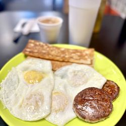 Four eggs over easy, sausage patties, Cuban toast, large cafe con leche