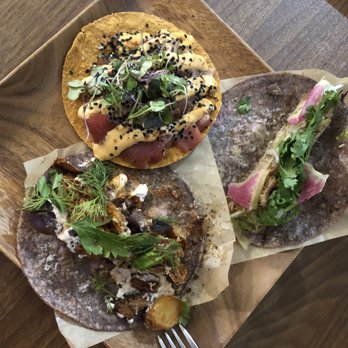 Nixta Taqueria - tuna tostada, duck carnitas on right w/watermelon radish, purple potato taco on left - Mexican Near Me - Austin, Texas Nixta Taqueria - tuna tostada, duck carnitas on right w/watermelon radish, purple potato taco on left - Mexican Near Me - Austin, Texas