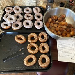 Donuts - lavender on top, coffee on bottom, cinnamon-sugar donut holes in the bowl.