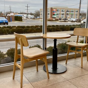 Starbucks - two chairs and a table in front of a window - Coffee & Tea Near Me - Downers Grove, Illinois