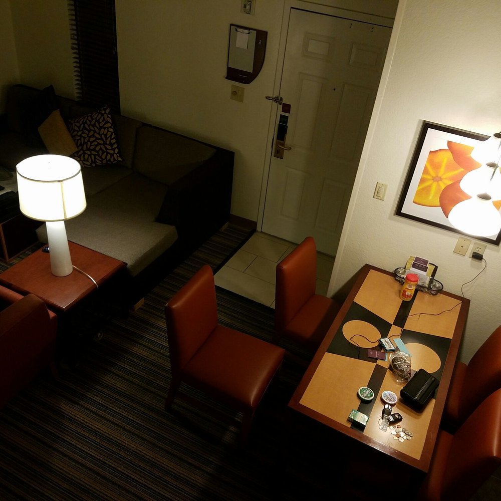 Residence Inn Phoenix - A very nice accommodating dining room compliments the living room with a fireplace. - Hotels Near Me - Phoenix, Arizona Residence Inn Phoenix - A very nice accommodating dining room compliments the living room with a fireplace. - Hotels Near Me - Phoenix, Arizona