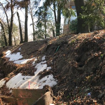 Mike Rose Masonry - Rear - before. Snow and rain destroyed old wooden retaining wall - Masonry/Concrete Near Me Mike Rose Masonry - Rear - before. Snow and rain destroyed old wooden retaining wall - Masonry/Concrete Near Me