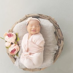 This is one of my favorite photos. She was 7 days old and even smiled :)