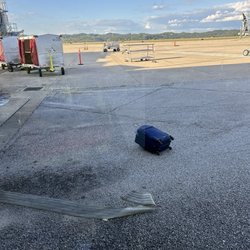 West Virginia International Yeager Airport - Bags stacked up high. Watched it fall off as turned corner